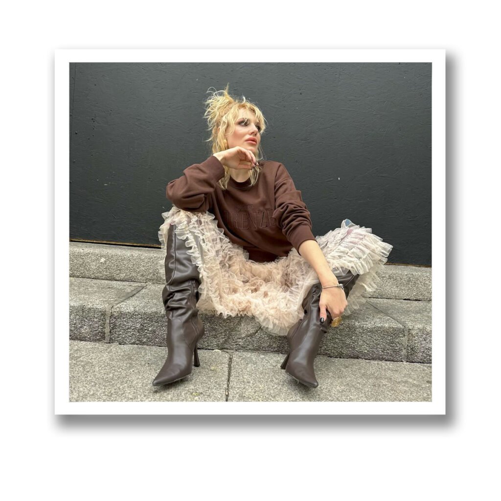 stylish lady sitting on stairs vinyl magnet